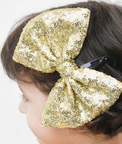 Manufactured by FAYON KIDS (Noida, U.P) Golden Glitter Bow Clip for Girls