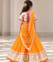 Offwhite Embroidered Choli with Orange Bandhej Lehenga