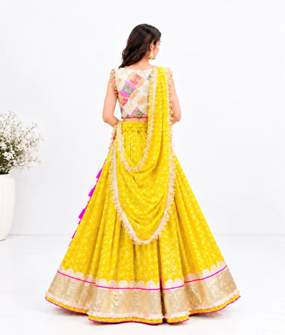 Offwhite Embroidered Choli with Yellow Bandhej Lehenga