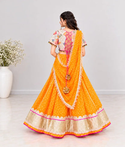 Offwhite Embroidered Choli with Orange Bandhej Lehenga