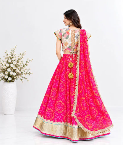 Offwhite Embroidered Choli with Coral Bandhej Lehenga