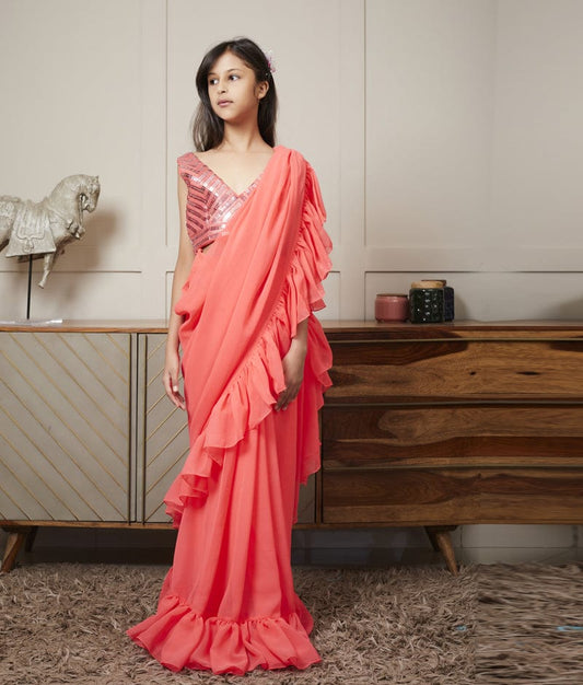 Manufactured by FAYON KIDS (Noida, U.P) Embroidered Blouse with Coral Peach Stitched Saree for Girls