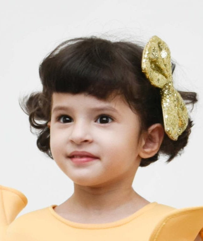 Manufactured by FAYON KIDS (Noida, U.P) Golden Glitter Bow Clip