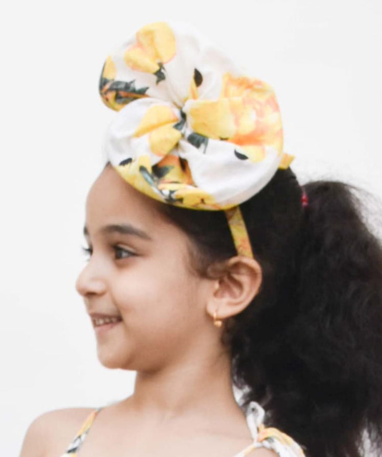 Manufactured by FAYON KIDS (Noida, U.P) Yellow Printed Twirls Hair band