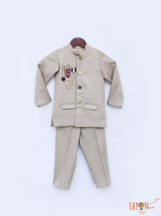 Gold Bandhgala Jacket with Brooches Gold Pant set for boys